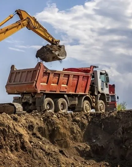 Excavator loading a dump truck